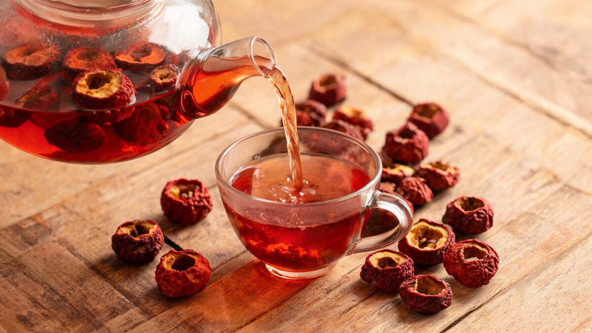 Dried hawthorn berries and red-amber hawthorn tea